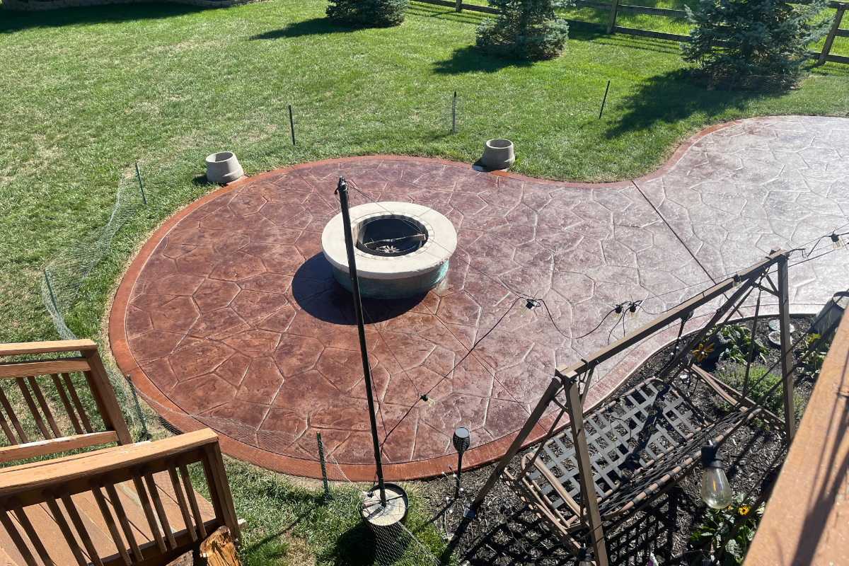 Antiquing - Patio - Aztec Brown - Russet Border - Stamped - Fire Pit Stamped patio restored with Aztec Brown stain and Russet border, featuring even color and soft satin sheen.
