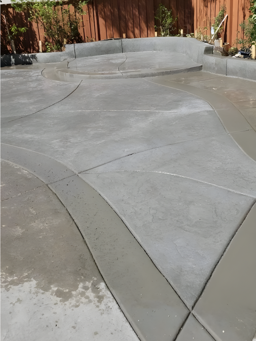 Antiquing - Patio - Before - Aztec Brown - Cafe Royale - Design Backyard concrete patio showing uneven color between new and old concrete before staining