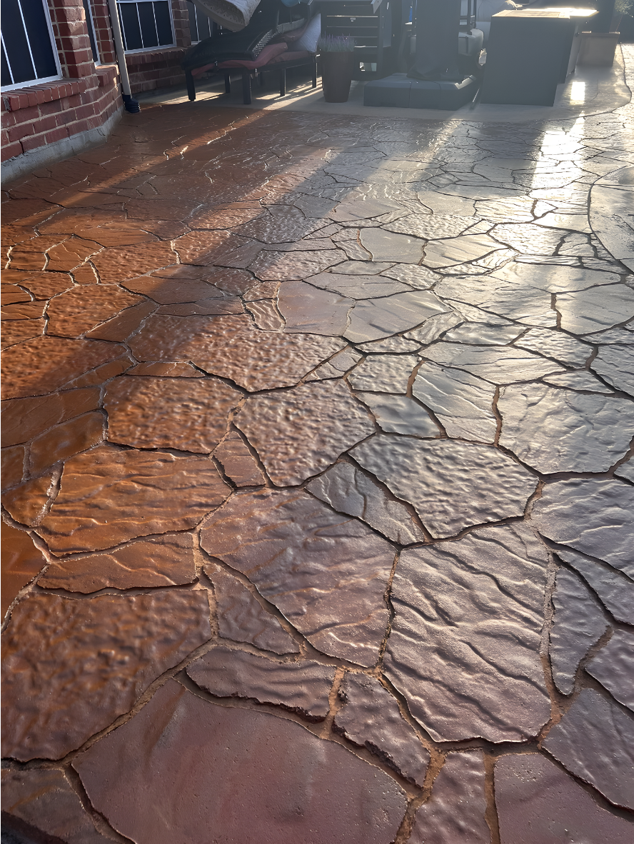 Stamped Patio - Portico Aztec Brown - EasyTint Maple Top Coat Stamped concrete patio restored with Aztec Brown stain and Maple EasyTint™ sealer, featuring a warm, glossy tone and durable finish