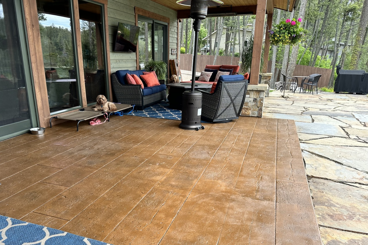 Wood-grain stamped concrete patio stained with Caf Royale EasyTint Wood-grain stamped concrete patio stained with Café Royale EasyTint™, featuring rich brown tones and a satin finish.
