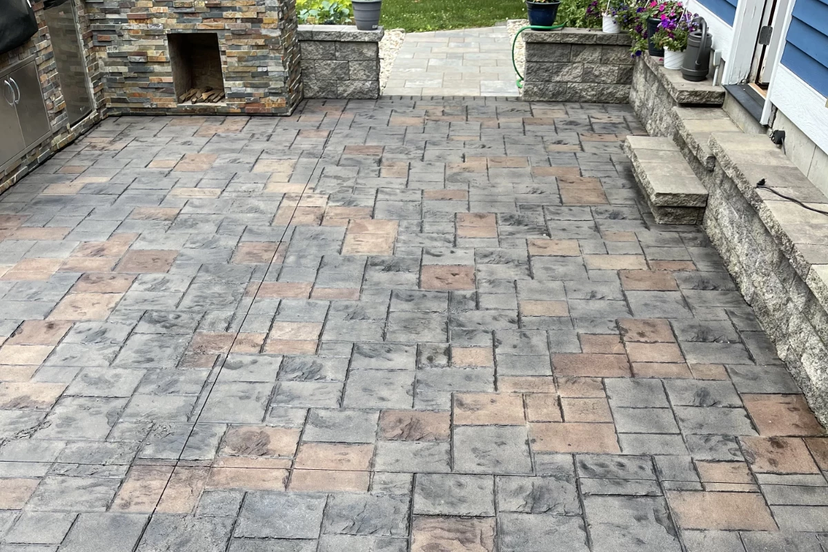 antiquing-stain-auburn-light-charcoal-stamped-ashlar-pattern-concrete-patio Restored stamped concrete patio stained with Auburn and Light Charcoal Antiquing Stains, finished with satin EasySeal sealer.