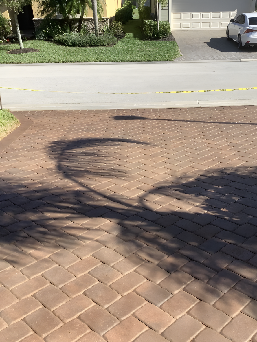 paver driveway refreshed with Caf Royale Portico™ Paver Stain Close-up of paver driveway refreshed with Café Royale Portico™ Paver Stain, showing even color and subtle sheen.