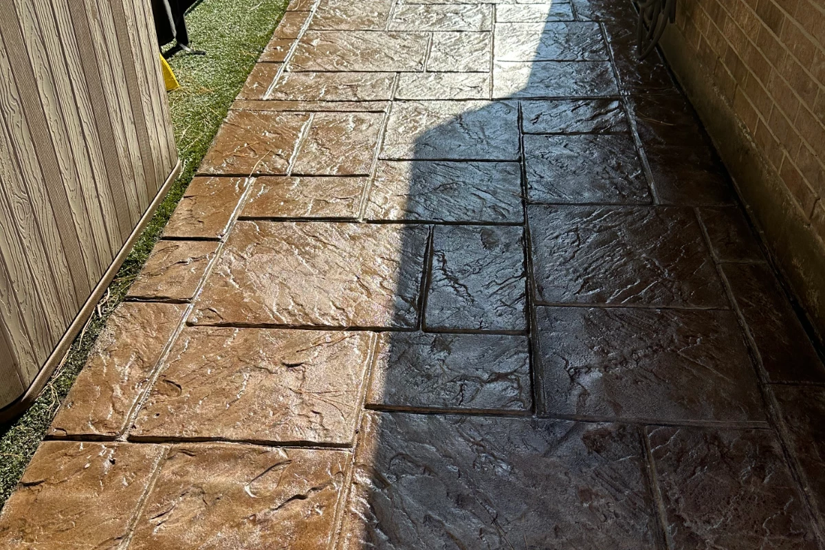 stamped concrete walkway with rich, warm tones from Aztec Brown Antiquing Stain Stamped concrete walkway with rich, warm tones from Aztec Brown Antiquing™ Stain and glossy water-based sealer finish