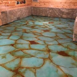 Smooth White Overlay, Azure Blue and Cola Acid Stains Sealed with Glossy Water Based Polyurethane Tuquoise Acid Stained Floor