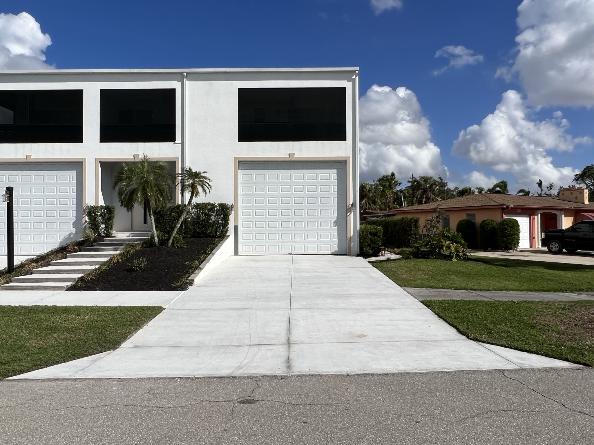 Post-grinding perfection: A smooth and even concrete driveway surface, ready for the transformative Charcoal stain application